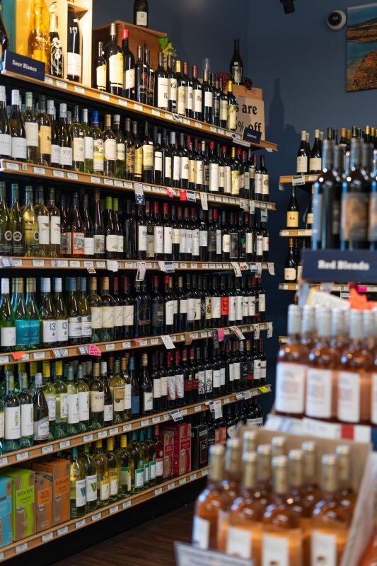 stocked shelf of glass bottles