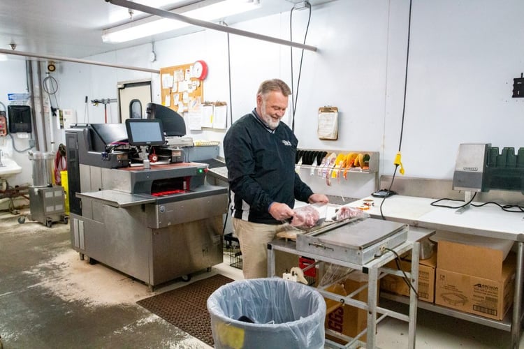 man handling deli meat