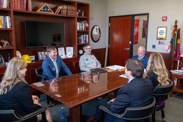 a group of people sitting at a table