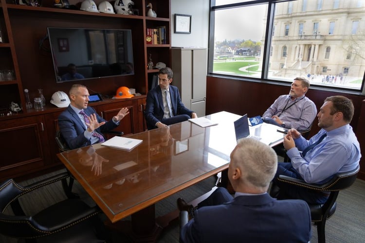 business men sitting around a table