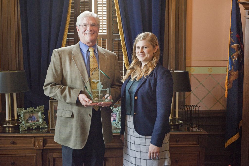 Amy Drumm presents Senate Majority Leader Mike Shirkey with the 2018 Legislator of the Year award. (Photo by Patrick D. Kerwin)