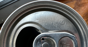 Overhead view of a soda can with the Michigan bottle deposit of $.10 indicated.